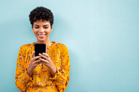 African stylish woman using smart phone